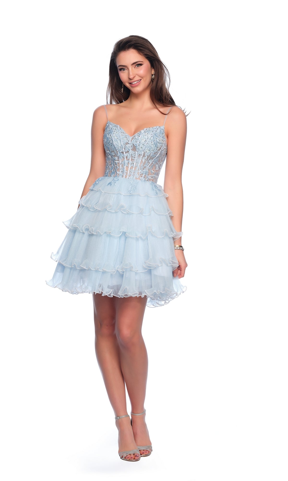 Woman smiling in the Dave and Johnny Short Blue A-Line Hoco Dress 11753, featuring a fitted bodice and ruffled party skirt, standing against a white background.